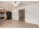Open-concept kitchen features modern appliances, wooden cabinets, and seamless access to the living space at 6606 N 46Th Ave, Glendale, AZ 85301