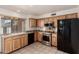 Beautiful kitchen featuring stainless steel appliances, light wood cabinets, and granite countertops at 6606 N 46Th Ave, Glendale, AZ 85301