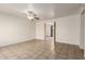 Spacious living room boasts tile flooring and a ceiling fan, offering a blend of comfort and style at 6606 N 46Th Ave, Glendale, AZ 85301