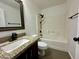 Well-lit bathroom featuring granite countertop, shower over tub and dark bronze fixtures at 740 W Dublin St, Gilbert, AZ 85233