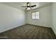 Bright bedroom featuring neutral carpeting, a ceiling fan, and a window providing natural light at 740 W Dublin St, Gilbert, AZ 85233