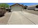 A single-story home featuring a driveway, well-kept landscaping, and an attached garage at 740 W Dublin St, Gilbert, AZ 85233
