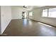 Spacious living room featuring neutral tile floors, a ceiling fan, and plenty of natural light at 740 W Dublin St, Gilbert, AZ 85233