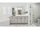 Elegant bathroom with a soaking tub, marble floors, and a large vanity with ample storage at 8045 E Del Caverna Dr, Scottsdale, AZ 85258