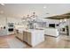 Beautiful kitchen with an oversized kitchen island that connects to the Gathering room at 8045 E Del Caverna Dr, Scottsdale, AZ 85258