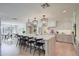 Spacious kitchen featuring a large island with seating and modern pendant lighting and seating at 8045 E Del Caverna Dr, Scottsdale, AZ 85258