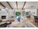 Bright and airy living room with hardwood floors, fireplace, and view of pool at 8045 E Del Caverna Dr, Scottsdale, AZ 85258