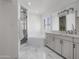 Bright bathroom features double sinks, a soaking tub, separate shower, and marble flooring at 8045 E Del Caverna Dr, Scottsdale, AZ 85258