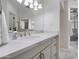 Clean, modern main bathroom with marble countertops, white cabinetry, and a glass-enclosed shower at 8045 E Del Caverna Dr, Scottsdale, AZ 85258