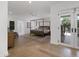 Open and airy main bedroom with a canopy bed, access to the outdoors, and light-colored floors at 8045 E Del Caverna Dr, Scottsdale, AZ 85258