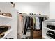 Walk-in closet featuring shelving, hanging rods, and ample storage space at 8651 E Royal Palm Rd # 121, Scottsdale, AZ 85258