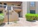 Exterior view of multi-Gathering villa with individual unit entrances and desert landscaping at 8651 E Royal Palm Rd # 121, Scottsdale, AZ 85258