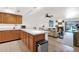 Open floor plan featuring kitchen, living, and dining areas with bright natural light at 8651 E Royal Palm Rd # 121, Scottsdale, AZ 85258