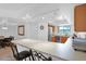 Open kitchen area features a breakfast bar, stainless steel refrigerator, and track lighting at 8651 E Royal Palm Rd # 121, Scottsdale, AZ 85258