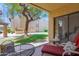 Relaxing outdoor patio area features a view of the landscaped yard at 8651 E Royal Palm Rd # 121, Scottsdale, AZ 85258
