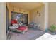 Relaxing patio with a chaise lounge, bistro table, and charming decor for outdoor enjoyment at 8651 E Royal Palm Rd # 121, Scottsdale, AZ 85258