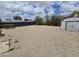 Gravel backyard with a storage shed, ready for your personal touch and landscaping ideas at 918 S Evangeline Ave, Mesa, AZ 85208