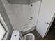 Bathroom features a new shower with modern fixtures, vinyl flooring, and a commode at 918 S Evangeline Ave, Mesa, AZ 85208