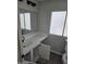 Bathroom showcasing a new vanity with modern sink, large mirror, and vinyl flooring at 918 S Evangeline Ave, Mesa, AZ 85208