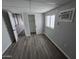 Comfortable bedroom featuring laminate flooring, neutral walls, and a closet at 918 S Evangeline Ave, Mesa, AZ 85208