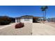 Charming single-story home with a covered carport and low-maintenance landscaping at 918 S Evangeline Ave, Mesa, AZ 85208
