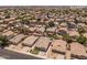 Aerial view of a home in a quiet community. Landscaping, backyard privacy, and community feel at 9329 E Olla Ave, Mesa, AZ 85212
