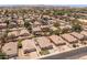 An aerial view of a neighborhood with a white line around the property of interest at 9329 E Olla Ave, Mesa, AZ 85212