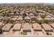 Neighborhood view with a highlighted home, well-maintained yard, and desert landscaping at 9329 E Olla Ave, Mesa, AZ 85212
