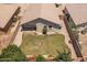 Aerial view of a spacious backyard with a fire pit and desert landscaping at 9329 E Olla Ave, Mesa, AZ 85212