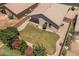 Aerial view of backyard featuring a fire pit, patio area, and desert landscaping at 9329 E Olla Ave, Mesa, AZ 85212