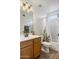 Well-lit bathroom features a single sink vanity and tub with shower at 9329 E Olla Ave, Mesa, AZ 85212