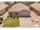 Attractive home with a tile roof, well-maintained lawn, desert landscaping, and a two-car garage at 9329 E Olla Ave, Mesa, AZ 85212