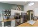Well-equipped kitchen showcases modern appliances, white cabinetry, and butcher block countertops at 9329 E Olla Ave, Mesa, AZ 85212