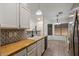 Well-maintained kitchen features a stainless steel refrigerator and eat-in dining area at 9329 E Olla Ave, Mesa, AZ 85212