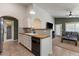 Open-concept kitchen offering sleek countertops, tile backsplash, and views to the living area at 9329 E Olla Ave, Mesa, AZ 85212