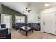 Inviting living room features neutral carpet, vaulted ceiling, and a sleek ceiling fan at 9329 E Olla Ave, Mesa, AZ 85212