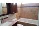 Updated bathroom with granite countertops, modern fixtures, and a tiled shower at 1009 E Hampton Ave, Mesa, AZ 85204