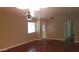 Inviting living room with hardwood floors, ceiling fan, and plenty of natural light at 1009 E Hampton Ave, Mesa, AZ 85204