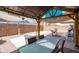 Backyard featuring a covered patio with a seating area and desert landscaping at 1017 W Lydia Ln, Phoenix, AZ 85041