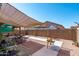 Backyard featuring a covered patio with desert landscaping and a block wall at 1017 W Lydia Ln, Phoenix, AZ 85041