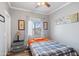 Bedroom with natural light, side table and warm tones at 1017 W Lydia Ln, Phoenix, AZ 85041