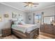 Bedroom featuring a bed, wood floors, a ceiling fan, and a window at 1017 W Lydia Ln, Phoenix, AZ 85041