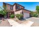 Charming two-story home with desert landscaping and a two-car garage at 1017 W Lydia Ln, Phoenix, AZ 85041
