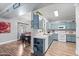 Open kitchen with blue cabinets and eat-in dining area at 1017 W Lydia Ln, Phoenix, AZ 85041