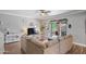 Cozy living room with a comfortable couch, wood-look floors, and backyard access at 1017 W Lydia Ln, Phoenix, AZ 85041