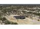 This aerial view shows the property situated amongst desert vegetation and other single-Gathering homes at 10772 N Biznaga St, Florence, AZ 85132