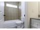 This bathroom features a shower over tub and granite countertops at 10772 N Biznaga St, Florence, AZ 85132