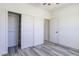 This bedroom has gray vinyl floors and a closet at 10772 N Biznaga St, Florence, AZ 85132