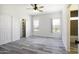 This bedroom has gray vinyl floors and dual closets at 10772 N Biznaga St, Florence, AZ 85132