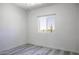 Bedroom with grey laminate flooring, white walls and ceiling fan at 10772 N Biznaga St, Florence, AZ 85132